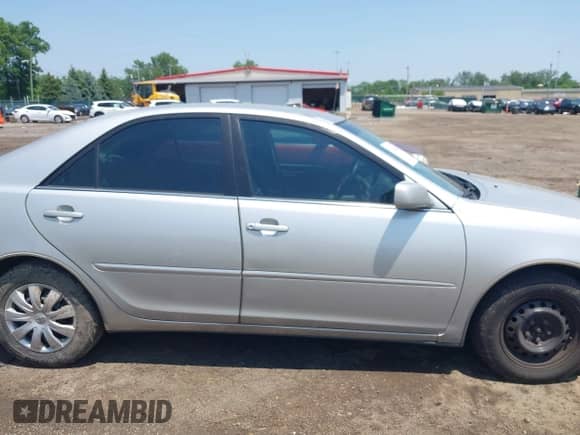 2004 Toyota Camry LE with VIN 4T1BE32KX4U865711, listed as a IAAI auction lot 42482401 with 111,082 mi miles and . Bid and sale history available at DreamBid. Image 13.