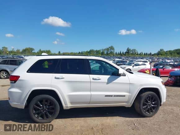 2017 Jeep Grand Cherokee Altitude with VIN 1C4RJFAG0HC714451, listed as a IAAI auction lot 43127236 with 116,501 mi miles and . Bid and sale history available at DreamBid. Image 14.