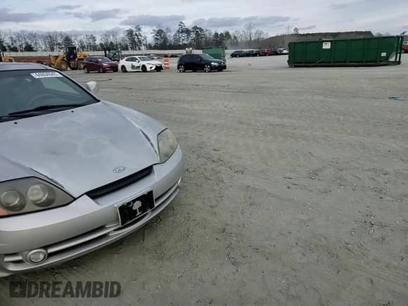 2003 Hyundai Tiburon GT с VIN KMHHN65F63U064962, выставлен на аукционе Copart как лот 44804045 с пробегом 186 171 миль миль и Списание • Salvage title. История ставок и продаж доступна на DreamBid. Изображение 11.
