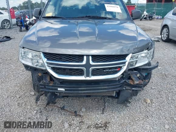 2013 Dodge Journey American Value z VIN 3C4PDCAB2DT560776, wystawiony jako IAAI lot #42988970 z przebiegiem 126 698 mil mil oraz . Historia ofert i sprzedaży dostępna na DreamBid. Obrazek 6.