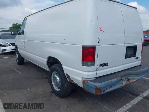 2002 Ford Econoline Cargo Commercial with VIN 1FTSE34L72HA79879, listed as a IAAI auction lot 42887771 with 303,228 mi miles and . Bid and sale history available at DreamBid. Image 3.
