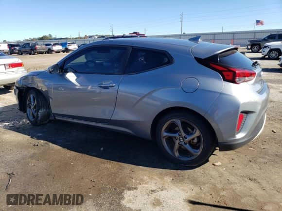 2019 Hyundai Veloster 2.0 z VIN KMHTG6AF1KU017833, wystawiony jako Copart lot #82904093 z przebiegiem 69 556 mil mil oraz . Historia ofert i sprzedaży dostępna na DreamBid. Obrazek 2.