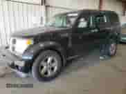2009 Dodge Nitro SXT z VIN 1D8GU28KX9W536809, wystawiony jako Copart lot #77500034 z przebiegiem 155 737 mil mil oraz Szkoda całkowita • Salvage title. Historia ofert i sprzedaży dostępna na DreamBid. Obrazek 1.