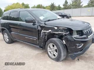 2014 Jeep Grand Cherokee Laredo z VIN 1C4RJFAG3EC471584, wystawiony jako IAAI lot #43412004 z przebiegiem 124 034 mil mil oraz . Historia ofert i sprzedaży dostępna na DreamBid. Obrazek 1.