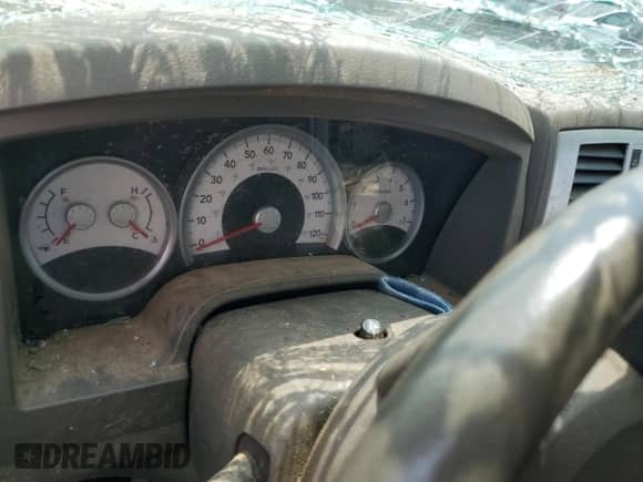 2005 Dodge Dakota Laramie z VIN 1D7HW58N15S145340, wystawiony jako Copart lot #58954154 z przebiegiem Nie podano mil oraz Szkoda całkowita • Salvage title. Historia ofert i sprzedaży dostępna na DreamBid. Obrazek 9.