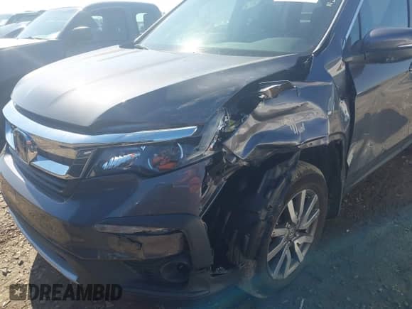 2020 Honda Pilot EX-L with VIN 5FNYF5H56LB003196, listed as a IAAI auction lot 41636258 with 76,868 mi miles and . Bid and sale history available at DreamBid. Image 6.