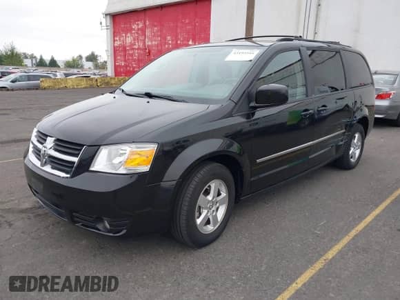 2010 Dodge Grand Caravan SXT with VIN 2D4RN5D19AR215735, listed as a IAAI auction lot 43195516 with 182,315 mi miles and . Bid and sale history available at DreamBid. Image 2.