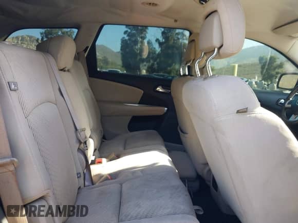 2013 Dodge Journey American Value z VIN 3C4PDCABXDT502219, wystawiony jako IAAI lot #43144633 z przebiegiem 166 589 mil mil oraz . Historia ofert i sprzedaży dostępna na DreamBid. Obrazek 8.