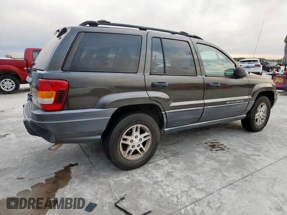2004 Jeep Grand Cherokee Laredo with VIN 1J4GW48S84C361744, listed as a Copart auction lot 91091115 with 236,095 mi miles and Clean title. Bid and sale history available at DreamBid. Image 3.