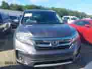 2022 Honda Pilot Touring 7-Passenger z VIN 5FNYF5H65NB001015, wystawiony jako IAAI lot #42523024 z przebiegiem 86 584 mil mil oraz . Historia ofert i sprzedaży dostępna na DreamBid. Obrazek 12.