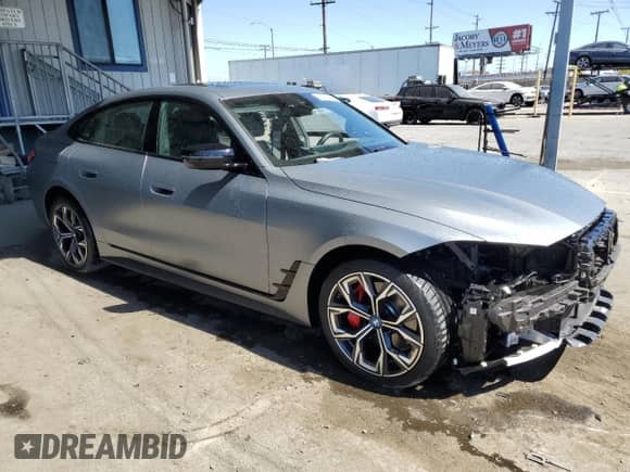 2024 BMW i4 eDrive35 with VIN WBY43AW05RFT55891, listed as a Copart auction lot 66478405 with 8,583 mi miles and Salvage title. Bid and sale history available at DreamBid. Image 4.