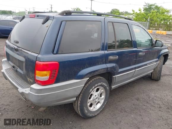 2002 Jeep Grand Cherokee Sport with VIN 1J4GW38S42C166263, listed as a IAAI auction lot 42521707 with 267,842 mi miles and . Bid and sale history available at DreamBid. Image 4.