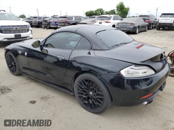 2012 BMW Z4 sDrive28i с VIN WBALL5C56CE716558, выставлен на аукционе Copart как лот 62003125 с пробегом 93 438 миль миль и Списание • Salvage title. История ставок и продаж доступна на DreamBid. Изображение 2.