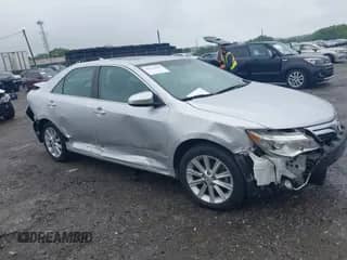 2014 Toyota Camry SE with VIN 4T1BK1FKXEU550951, listed as a IAAI auction lot 42373320 with 31,128 mi miles and . Bid and sale history available at DreamBid. Image 1.