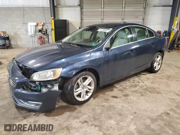 2015 Volvo S60 T5 Drive-E Premier with VIN YV126MFK9F1354636, listed as a Copart auction lot 61228855 with 143,125 mi miles and Salvage title. Bid and sale history available at DreamBid. Image 1.