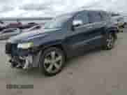 2016 Jeep Grand Cherokee Overland with VIN 1C4RJFCG6GC489769, listed as a Copart auction lot 82302855 with 136,225 mi miles and Salvage title. Bid and sale history available at DreamBid. Image 1.