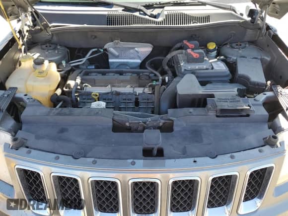 2012 Jeep Compass Sport z VIN 1C4NJCBA0CD618121, wystawiony jako Copart lot #84818275 z przebiegiem 170 126 mil mil oraz Szkoda całkowita • Salvage title. Historia ofert i sprzedaży dostępna na DreamBid. Obrazek 11.