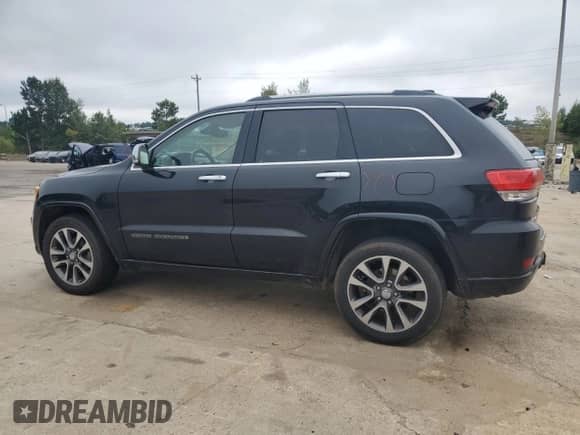 2017 Jeep Grand Cherokee Overland with VIN 1C4RJFCG8HC940430, listed as a Copart auction lot 68780995 with 150,371 mi miles and Salvage title. Bid and sale history available at DreamBid. Image 2.