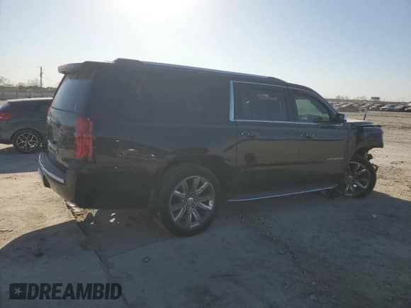 2019 Chevrolet Suburban Premier with VIN 1GNSCJKCXKR408508, listed as a Copart auction lot 50618465 with 79,258 mi miles and Salvage title. Bid and sale history available at DreamBid. Image 3.