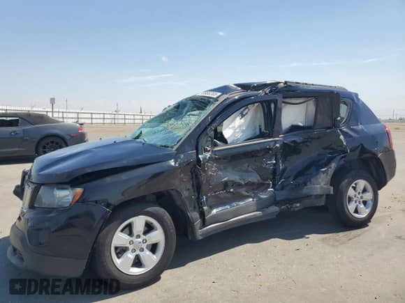 2014 Jeep Compass Sport with VIN 1C4NJCBA9ED925595, listed as a Copart auction lot 69980205 with 115,857 mi miles and Salvage title. Bid and sale history available at DreamBid. Image 1.