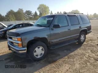 1999 Chevrolet Tahoe with VIN 1GNEK13R1XJ343041, listed as a Copart auction lot 84004565 with 207,997 mi miles and Salvage title. Bid and sale history available at DreamBid. Image 1.