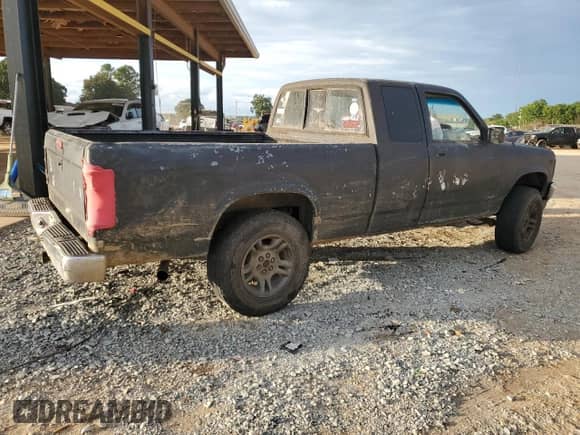 1995 Dodge Dakota z VIN 1B7GG23Y1SS183049, wystawiony jako Copart lot #72961204 z przebiegiem 406 345 mil mil oraz Czysty tytuł • Clean title. Historia ofert i sprzedaży dostępna na DreamBid. Obrazek 3.