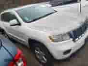 2012 Jeep Grand Cherokee Laredo z VIN 1C4RJFAG2CC248790, wystawiony jako IAAI lot #43563104 z przebiegiem 162 187 mil mil oraz . Historia ofert i sprzedaży dostępna na DreamBid. Obrazek 1.