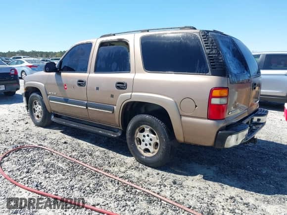 2003 Chevrolet Tahoe LT z VIN 1GNEC13Z33R190168, wystawiony jako IAAI lot #41858522 z przebiegiem 359 289 mil mil oraz . Historia ofert i sprzedaży dostępna na DreamBid. Obrazek 3.