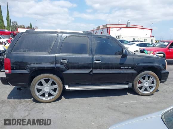 2004 Cadillac Escalade z VIN 1GYEK63N14R234928, wystawiony jako IAAI lot #43195673 z przebiegiem 73 814 mil mil oraz . Historia ofert i sprzedaży dostępna na DreamBid. Obrazek 13.