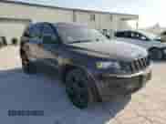 2015 Jeep Grand Cherokee Altitude with VIN 1C4RJFAG0FC742506, listed as a Copart auction lot 68986094 with 101,564 mi miles and Salvage title. Bid and sale history available at DreamBid. Image 4.