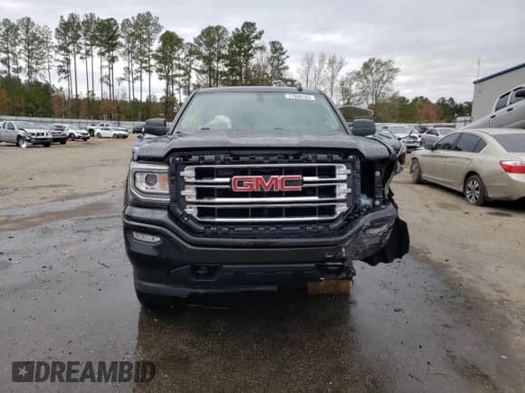 2017 GMC Sierra 1500 SLE z VIN 1GTR1MECXHZ338866, wystawiony jako Copart lot #77050163 z przebiegiem 51 798 mil mil oraz Czysty tytuł • Clean title. Historia ofert i sprzedaży dostępna na DreamBid. Obrazek 5.