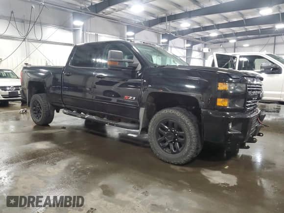 2018 Chevrolet Silverado 2500HD LTZ с VIN 1GC1KWEG8JF145258, выставлен на аукционе Copart как лот 68921115 с пробегом 96 594 миль миль и Списание • Salvage title. История ставок и продаж доступна на DreamBid. Изображение 4.