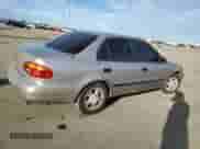 1999 Chevrolet Prizm z VIN 1Y1SK5485XZ406454, wystawiony jako Copart lot #46359765 z przebiegiem 158 025 mil mil oraz Nie do naprawy • Non repairable. Historia ofert i sprzedaży dostępna na DreamBid. Obrazek 3.