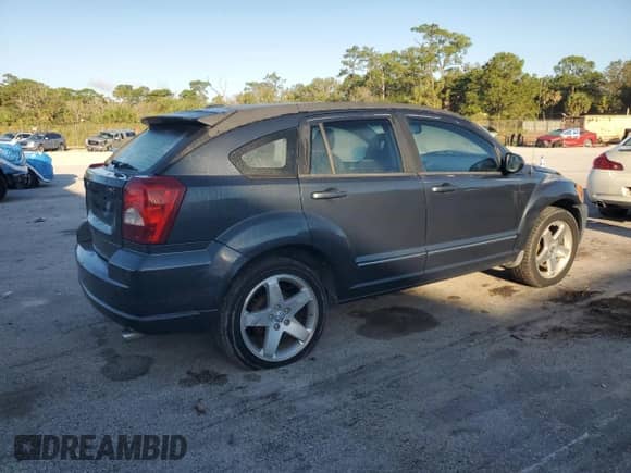 2008 Dodge Caliber R/T with VIN 1B3HB78K28D658677, listed as a Copart auction lot 87190735 with 197,297 mi miles and Salvage title. Bid and sale history available at DreamBid. Image 3.