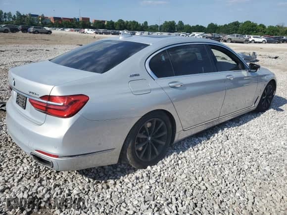 2017 BMW 7 Series 740e xDrive with VIN WBA7J2C3XHG497958, listed as a Copart auction lot 58203604 with 75,256 mi miles and Salvage title. Bid and sale history available at DreamBid. Image 3.
