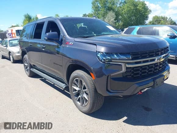 2022 Chevrolet Suburban Z71 z VIN 1GNSKDKD6NR122902, wystawiony jako IAAI lot #43154227 z przebiegiem 37 244 mil mil oraz . Historia ofert i sprzedaży dostępna na DreamBid. Obrazek 1.