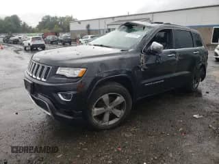 2015 Jeep Grand Cherokee Overland with VIN 1C4RJFCG3FC646446, listed as a Copart auction lot 81763795 with 126,084 mi miles and Salvage title. Bid and sale history available at DreamBid. Image 1.