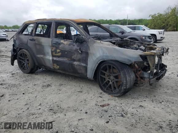 2012 Jeep Grand Cherokee SRT-8 с VIN 1C4RJFDJ0CC113413, выставлен на аукционе Copart как лот 51763425 с пробегом Не указан миль и На запчасти • Non repairable. История ставок и продаж доступна на DreamBid. Изображение 4.