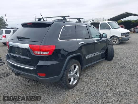 2013 Jeep Grand Cherokee Limited z VIN 1C4RJFBT4DC503856, wystawiony jako IAAI lot #43166356 z przebiegiem 143 262 mil mil oraz . Historia ofert i sprzedaży dostępna na DreamBid. Obrazek 4.