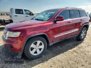 2012 Jeep Grand Cherokee Laredo z VIN 1C4RJFAG8CC218905, wystawiony jako Copart lot #86124715 z przebiegiem 243 617 mil mil oraz Czysty tytuł • Clean title. Historia ofert i sprzedaży dostępna na DreamBid. Obrazek 1.