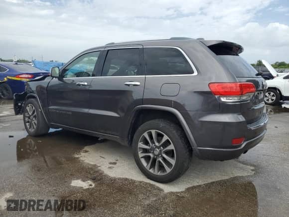 2017 Jeep Grand Cherokee Overland with VIN 1C4RJECG5HC605538, listed as a Copart auction lot 81946415 with 100,658 mi miles and Salvage title. Bid and sale history available at DreamBid. Image 2.
