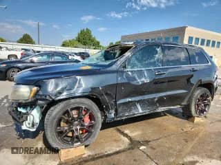 2012 Jeep Grand Cherokee SRT-8 z VIN 1C4RJFDJ6CC351718, wystawiony jako Copart lot #70483635 z przebiegiem 110 822 mil mil oraz Szkoda całkowita • Salvage title. Historia ofert i sprzedaży dostępna na DreamBid. Obrazek 1.