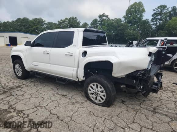 2024 Toyota Tacoma SR5 with VIN 3TYLB5JN2RT035281, listed as a Copart auction lot 69350095 with 9,907 mi miles and Salvage title. Bid and sale history available at DreamBid. Image 2.
