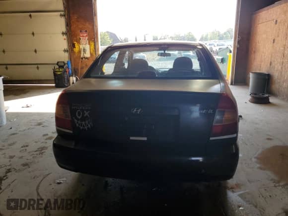 2000 Hyundai Accent with VIN KMHCG45G9YU127156, listed as a Copart auction lot 63414815 with 91,446 mi miles and Clean title. Bid and sale history available at DreamBid. Image 6.