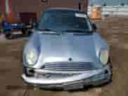 2004 MINI Hardtop with VIN WMWRC33454TJ56308, listed as a Copart auction lot 59690865 with 99,374 mi miles and Salvage title. Bid and sale history available at DreamBid. Image 5.