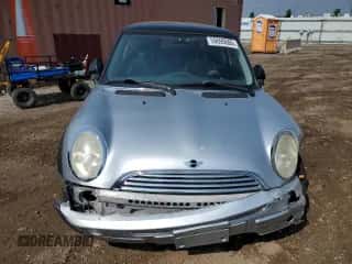 2004 MINI Hardtop with VIN WMWRC33454TJ56308, listed as a Copart auction lot 59690865 with 99,374 mi miles and Salvage title. Bid and sale history available at DreamBid. Image 5.