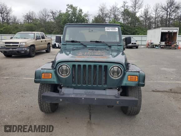 2001 Jeep Wrangler Sahara z VIN 1J4FA59S21P349009, wystawiony jako Copart lot #64310995 z przebiegiem 87 642 mil mil oraz Czysty tytuł • Clean title. Historia ofert i sprzedaży dostępna na DreamBid. Obrazek 5.