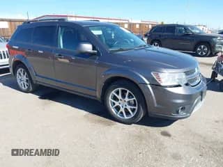 2014 Dodge Journey SXT with VIN 3C4PDDBG8ET214636, listed as a IAAI auction lot 41651140 with 141,742 mi miles and . Bid and sale history available at DreamBid. Image 1.