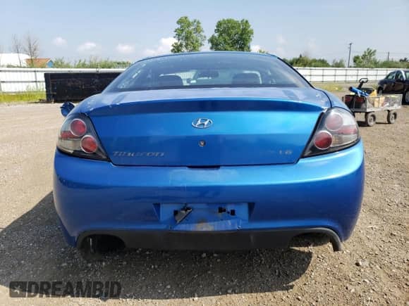 2007 Hyundai Tiburon GT с VIN KMHHN66F17U239526, выставлен на аукционе Copart как лот 64397625 с пробегом 136 807 миль миль и Списание • Salvage title. История ставок и продаж доступна на DreamBid. Изображение 6.