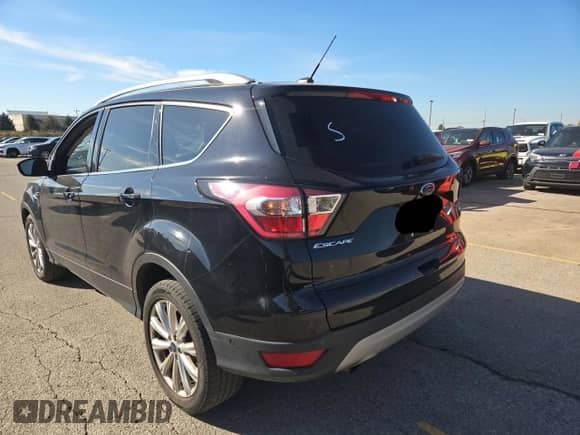 2017 Ford Escape Titanium с VIN 1FMCU9JD7HUB88314, выставлен на аукционе Copart как лот 90627415 с пробегом 165 953 миль миль и Чистый • Clean title. История ставок и продаж доступна на DreamBid. Изображение 3.